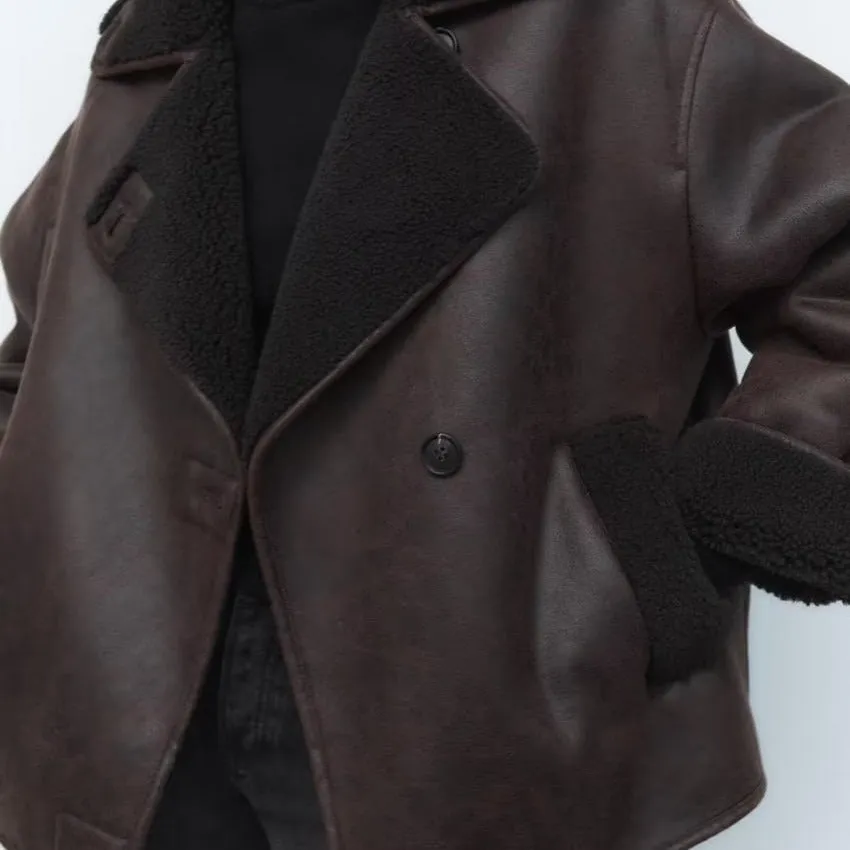 Coat in synthetic shearling and leather